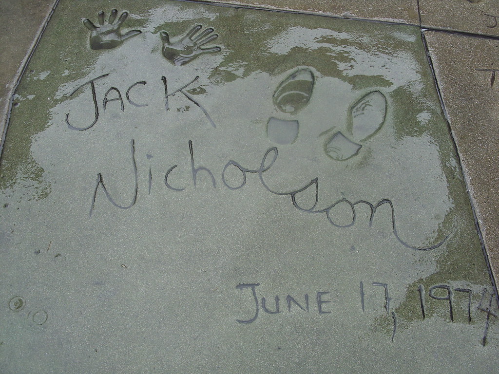 how did the practice of movie stars placing their footprints in front of graumans chinese theatre begin