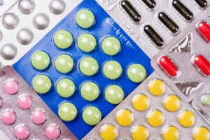 what was the name of the first commercially available oral contraceptive pill