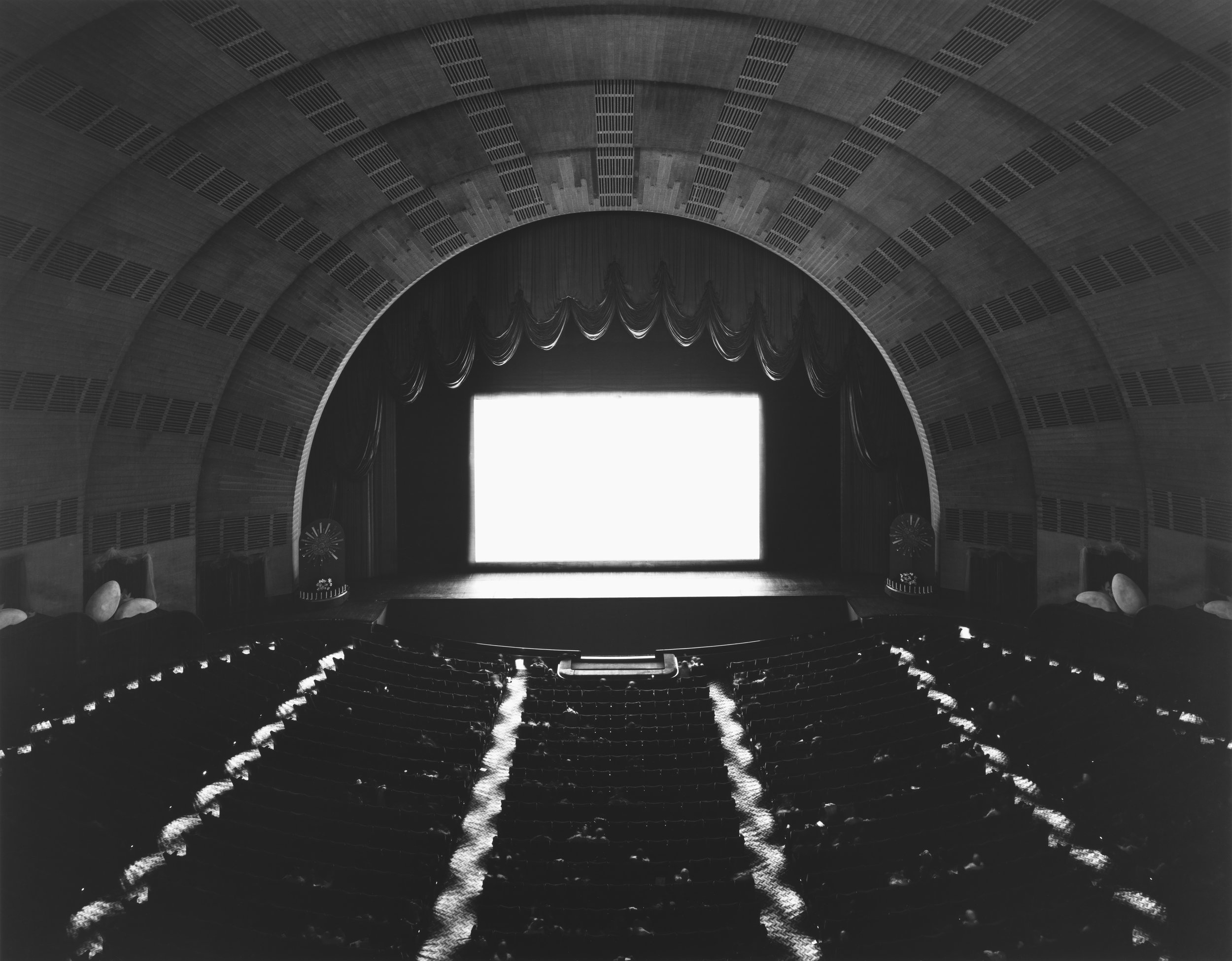 what were the first and last regular showings of movies in radio city music hall